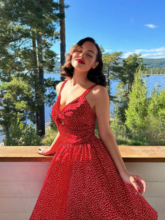 She slips into this Red 1950s Spaghetti Strap Heart Print Dress and suddenly it's a 1950s daydream