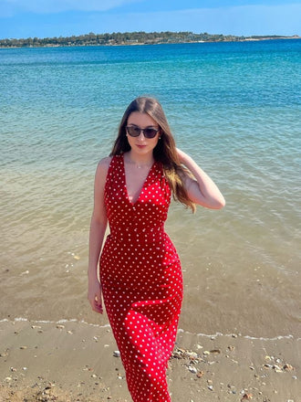 She slips into this Red 1960s Dots V-Neck Pencil Dress and suddenly it's a 1960s daydream