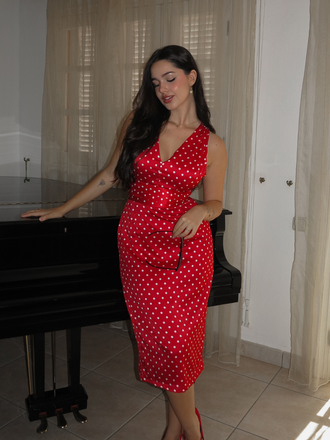 She slips into this Red 1960s Dots V-Neck Pencil Dress and suddenly it's a 1960s daydream