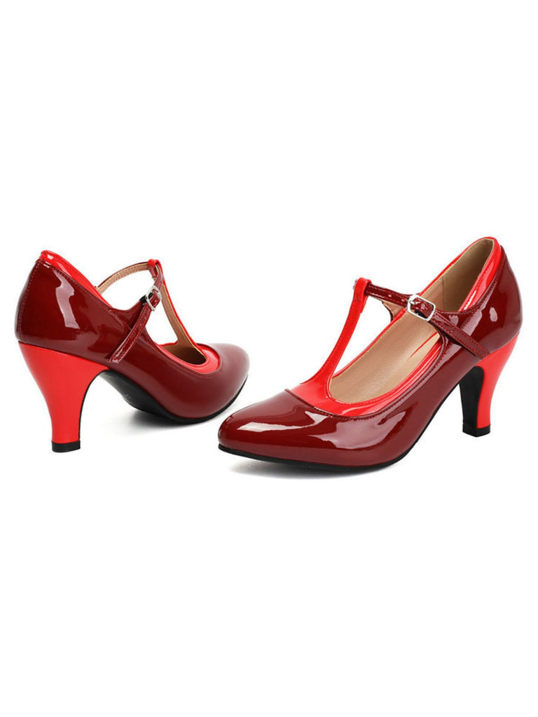 Pair of red high-heeled shoes with a strap on a white background