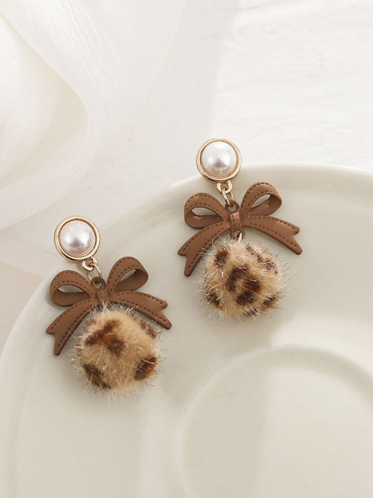 Retro Bow Leopard Earrings — 1950s elegance in the palm of her hand