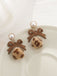 Retro Bow Leopard Earrings — 1950s elegance in the palm of her hand
