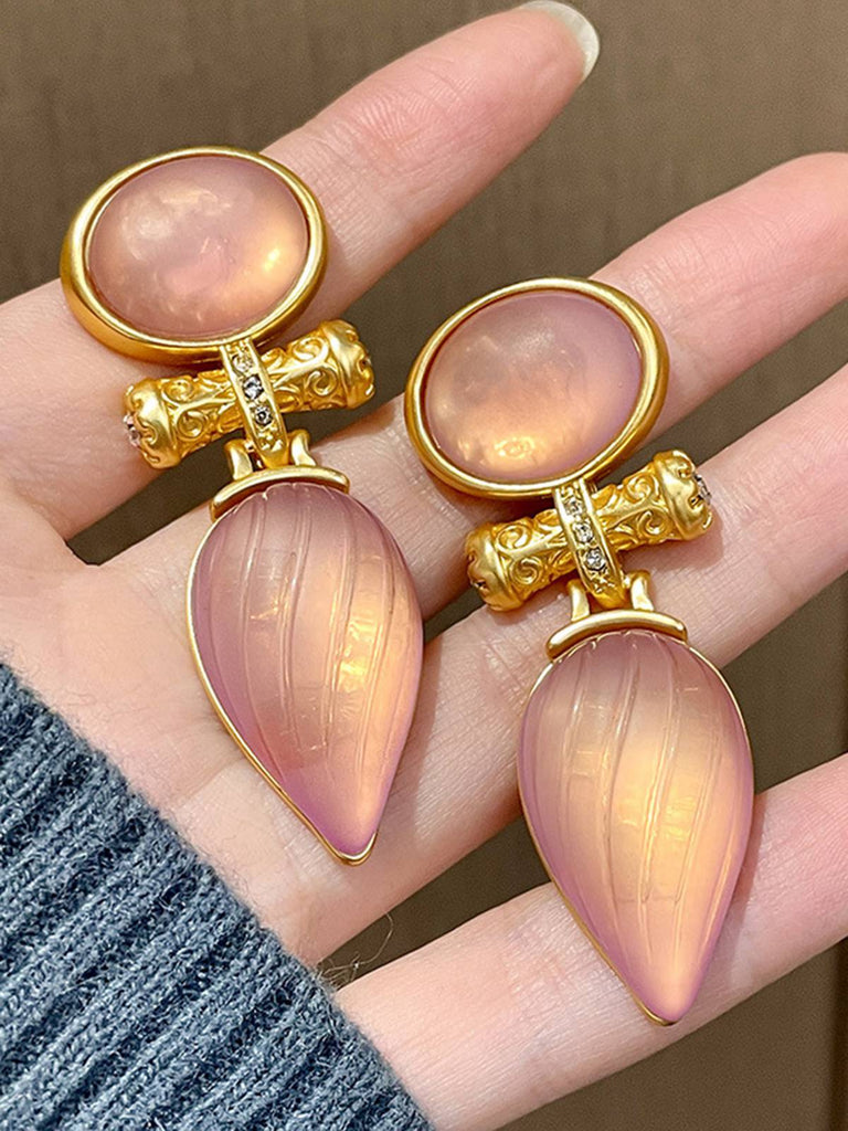 She adds this Rose Gold Vintage Water Drop Stripe Earrings and suddenly it's 1950s perfection
