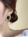 Gold-Rimmed Black Gemstone Earrings