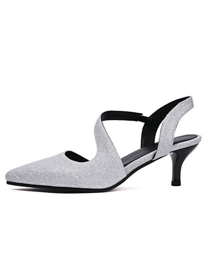 Silver glitter high-heeled shoes with black straps on a white background