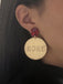 She adds this Sparkling 2025 Glitter Disco Earrings and suddenly it's vintage perfection
