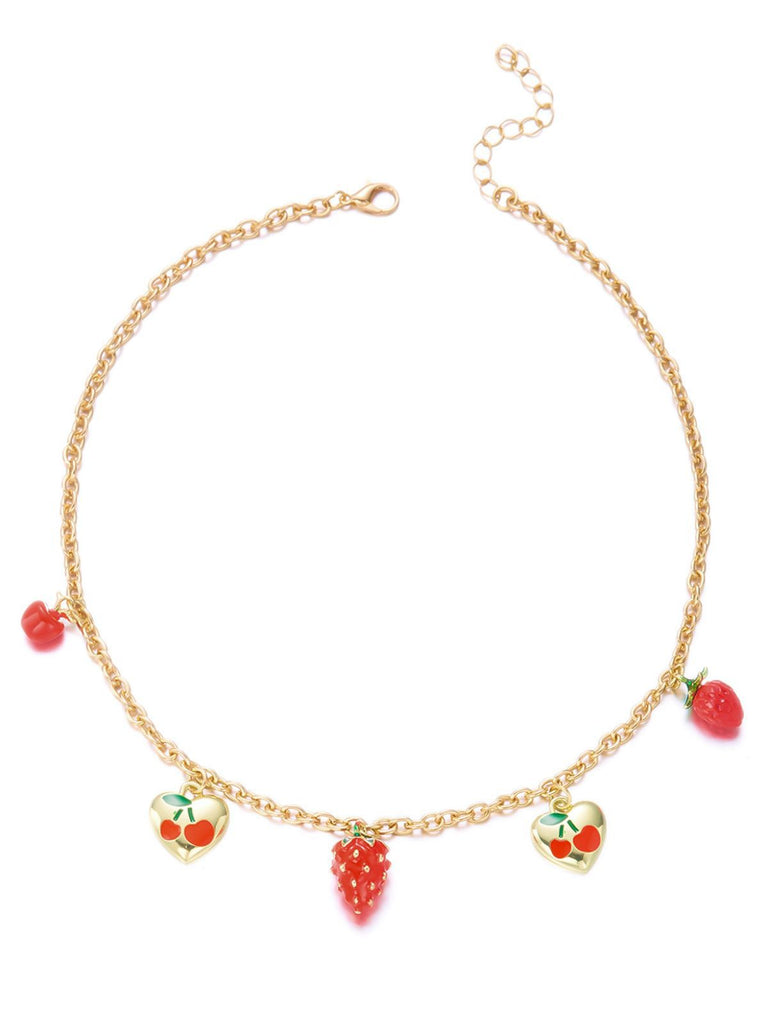 Gold necklace with heart-shaped fruit charms on a white background