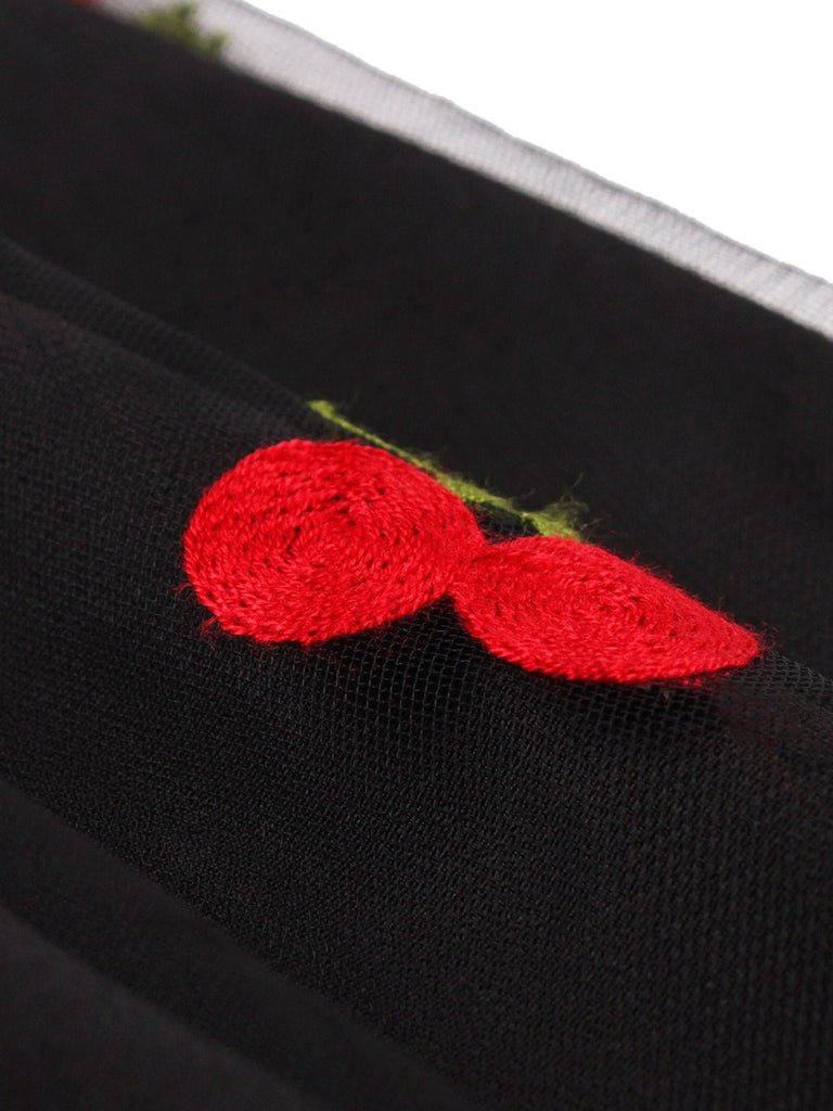 This Vintage 1950s Mesh Cherry Skirt spins 1950s stories with every step