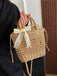 She adds this Vintage Boho Bow Straw Handbag and suddenly it's 1950s perfection