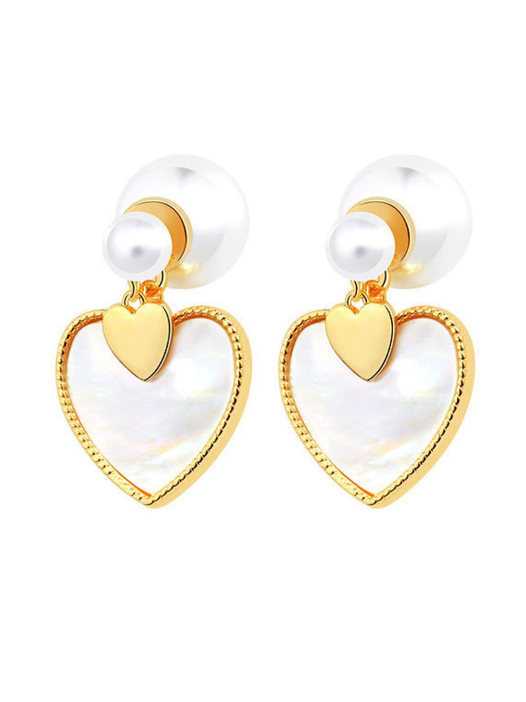 She adds this Vintage Gold Edged Pearl Heart Earrings and suddenly it's 1950s perfection