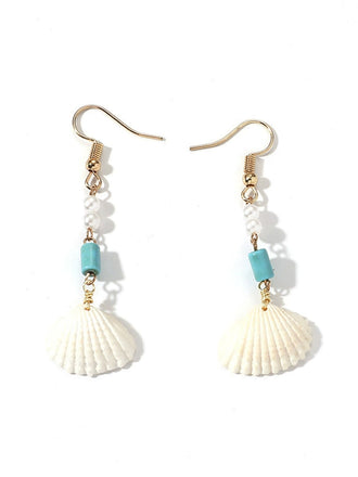 She adds this Vintage Pearl Seashell Drop Earrings and suddenly it's 1950s perfection