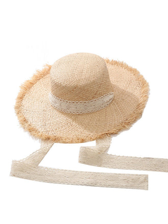 She adds this Vintage Straw Wide Brim Sun Hat and suddenly it's 1950s perfection