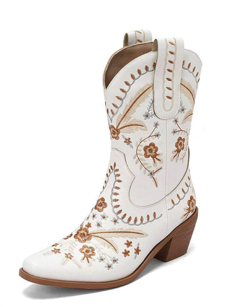 White cowboy boot with brown floral embroidery on a white background