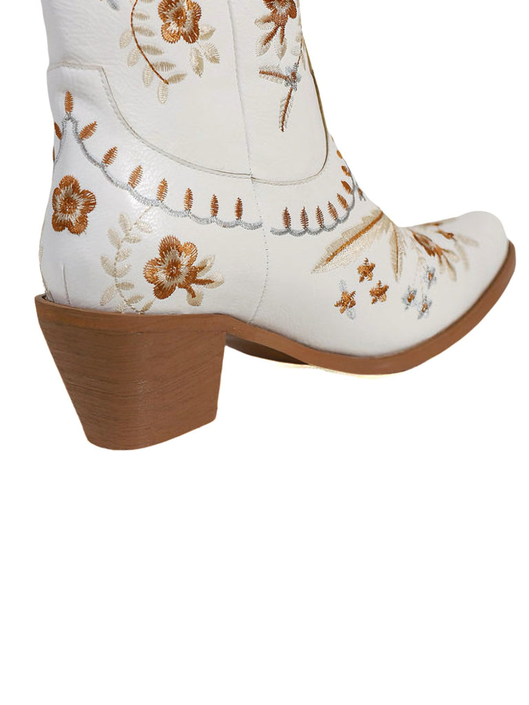 White cowboy boot with brown floral embroidery on a white background