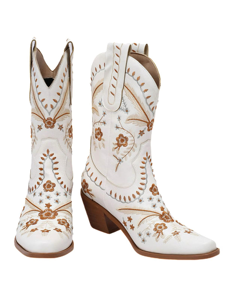 White cowboy boots with brown floral embroidery on a white background