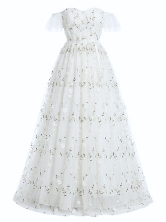 White dress with floral embroidery on a white background