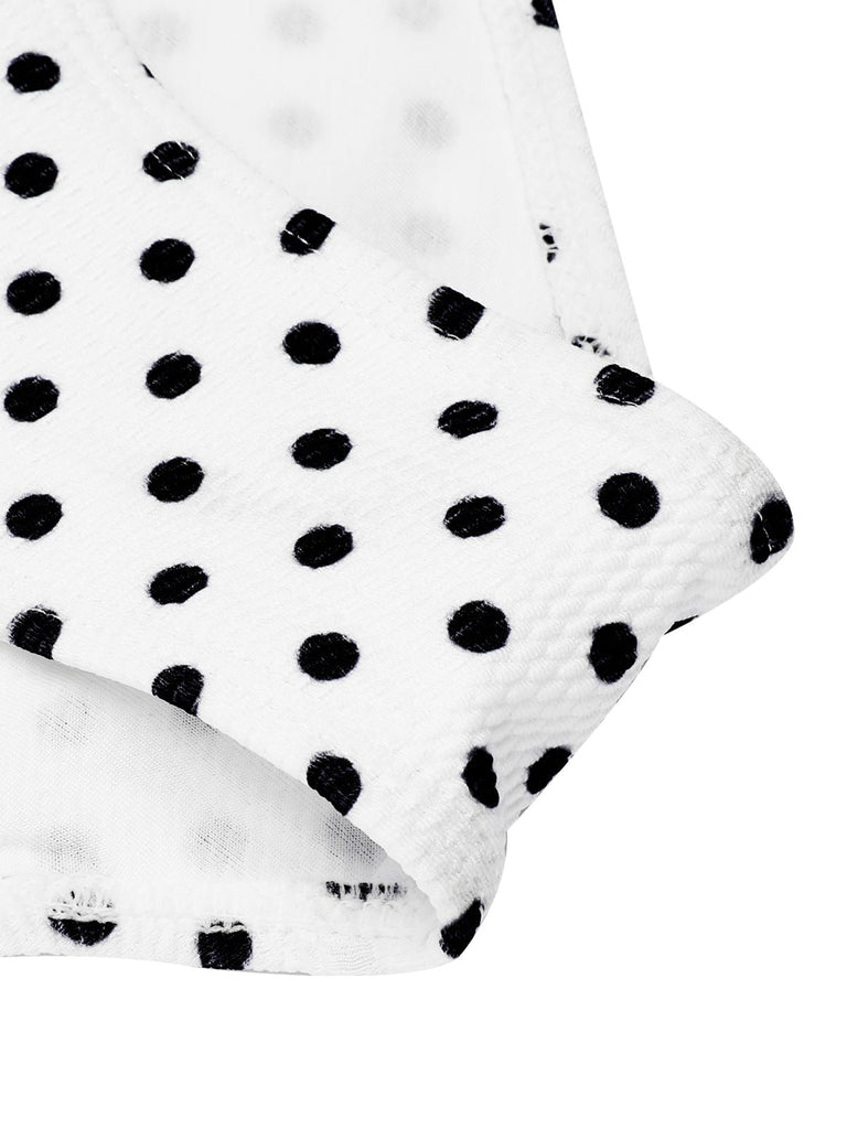 She's wearing White 1940s Polka Dot Lace Up Halter Swimsuit and the whole beach remembers the 1940s