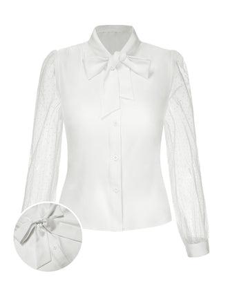 She pairs this White 1940s Tie Neck Mesh Swiss Dots Blouse with confidence and 1940s charm