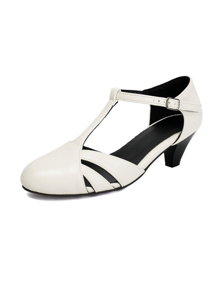 Classic closed toe T-strap heels featuring vintage styling, medium height and side cutout details ideal for office wear and special occasions
