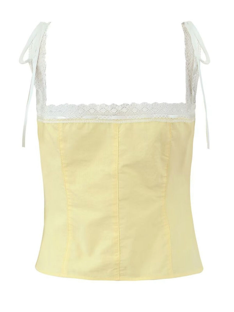 Yellow camisole with lace trim on a white background
