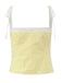 Yellow camisole with lace trim on a white background