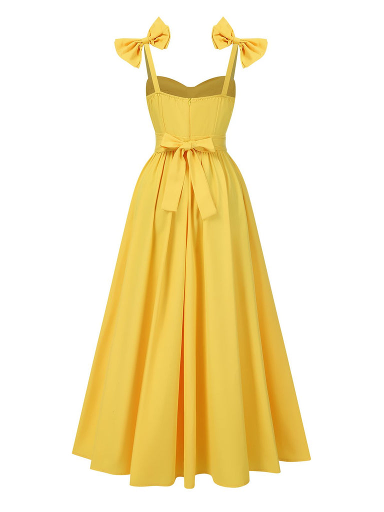 This Yellow 1950s Heart Neck Bow-Strap Tiered Dress wraps her in 1950s elegance, one twirl at a time