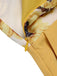 Close-up: 1950s Yellow 1950s Sunflower Halter Romper, perfect for vintage themed parties and retro fashion enthusiasts