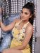 She finds her 1950s story in this Yellow 1950s Sunflower Halter Romper