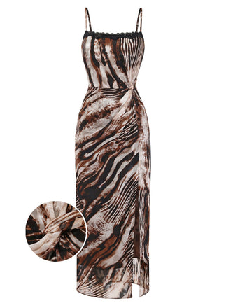 A sexy midi cami dress featuring a brown and black animal print, delicate black lace trim at the neckline, and a daring side slit.