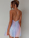 Rear view of a model wearing the rainbow sequin dress, highlighting the elegant backless look and delicate strap details.