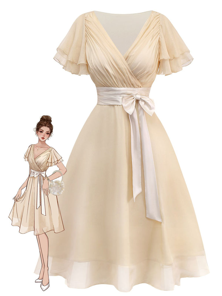 A beige vintage-style 1950s swing dress with flutter sleeves, a surplice V-neck, and a white satin bow belt at the waist.