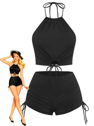 Stylish black vintage halter bikini set with ruched detailing and 1960s-inspired design, perfect for beach vacations and poolside lounging