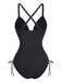 Rear view of the black one-piece swimsuit highlighting the elegant cross-back strap design and full coverage bottom.