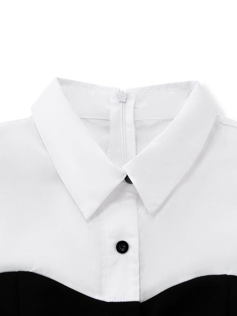 Close-up of a white shirt collar with a black button on a white background