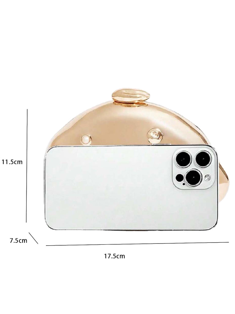 A side-by-side view comparing the size of the gold clutch to a smartphone.