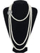 A Great Gatsby style long multi-strand pearl necklace displayed on a black mannequin, highlighting its elegant drape.