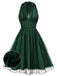 A green 1950s style swing dress with a black polka dot mesh overlay, featuring a halter neck and sleeveless design, shown with a fashion illustration.