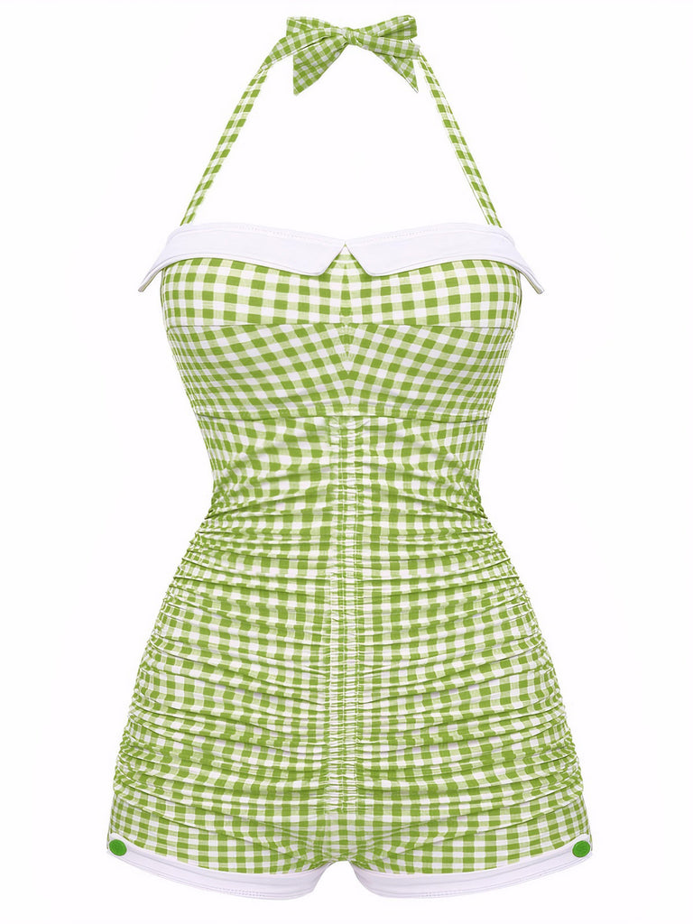 A vintage-style one-piece swimsuit with a halter neck and bowknot detail, featuring a vibrant green and white gingham pattern.