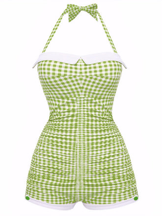 A vintage-style one-piece swimsuit with a halter neck and bowknot detail, featuring a vibrant green and white gingham pattern.