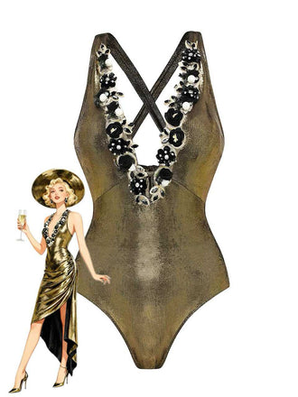 A metallic gold one-piece swimsuit featuring a deep V-neckline adorned with black and white floral appliqués, shown with a retro-style fashion illustration.