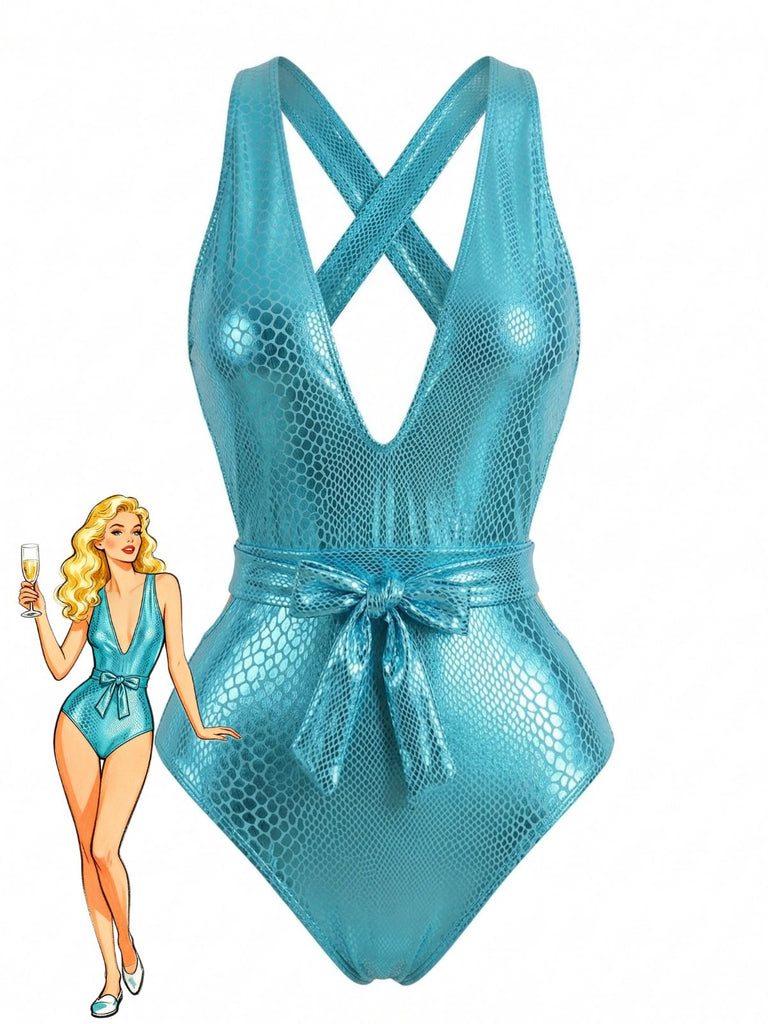 A metallic teal one-piece swimsuit featuring a textured snake-print pattern, a plunging V-neckline, criss-cross shoulder straps, and a matching tie-waist belt.