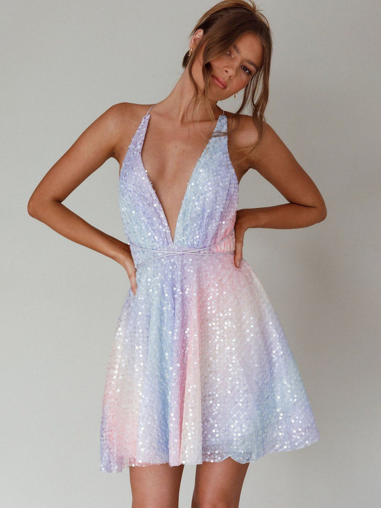 A model wearing the pastel rainbow sequin mini dress, demonstrating the fit and shimmer of the fabric for party or event wear.