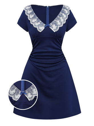 An elegant navy blue retro-style dress featuring a wide white floral lace V-neckline with a small blue bow accent.