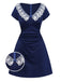 An elegant navy blue retro-style dress featuring a wide white floral lace V-neckline with a small blue bow accent.