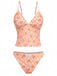 Retro orange deep V-neck tankini featuring ditsy floral pattern in 70s style, ideal for summer getaways and vintage-themed pool parties