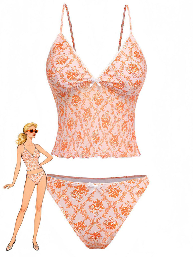 Vintage orange 1970s tankini swimsuit with deep V-neckline and delicate floral print, perfect for beach vacations and poolside lounging