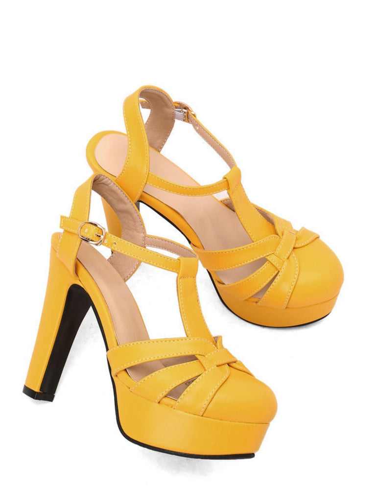 Pair of bright yellow sandals featuring a thick block heel and a secure T-shaped ankle strap.