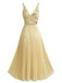 Back view of the pale gold midi dress showcasing the deep V-cut back and the continuous flow of the pleated skirt.