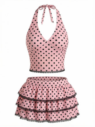 Pink polka dot halter tankini top with ruffled swim skirt in vintage 1950s style, perfect for beach swimming and summer poolside activities