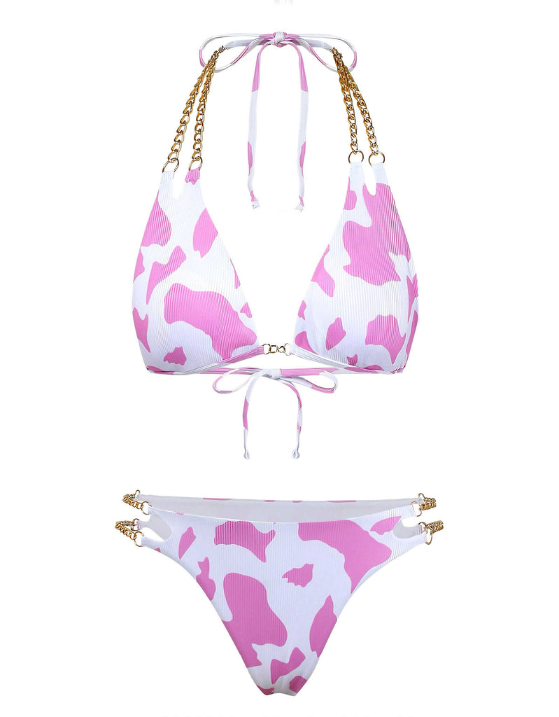 Front view of the bikini set featuring a playful pink and white cow print.